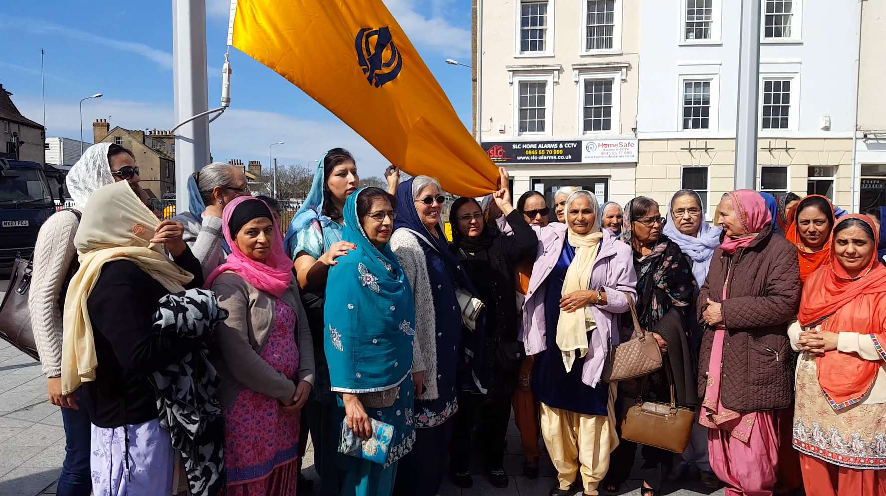 Some of Gravesend's Sikh community prepare for the flag raising.