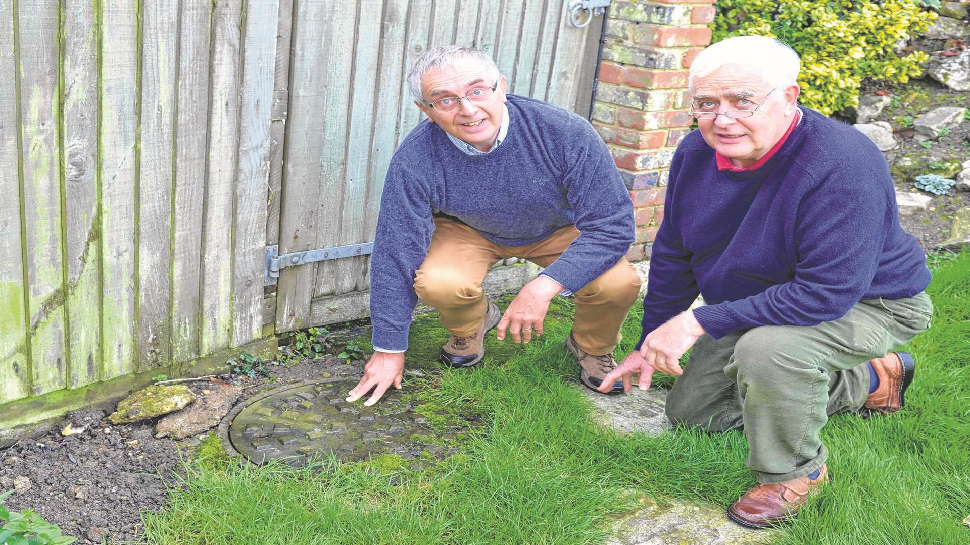 Cllr John Cobbett and Mike Fletcher by the drain that has to be pumped regulary