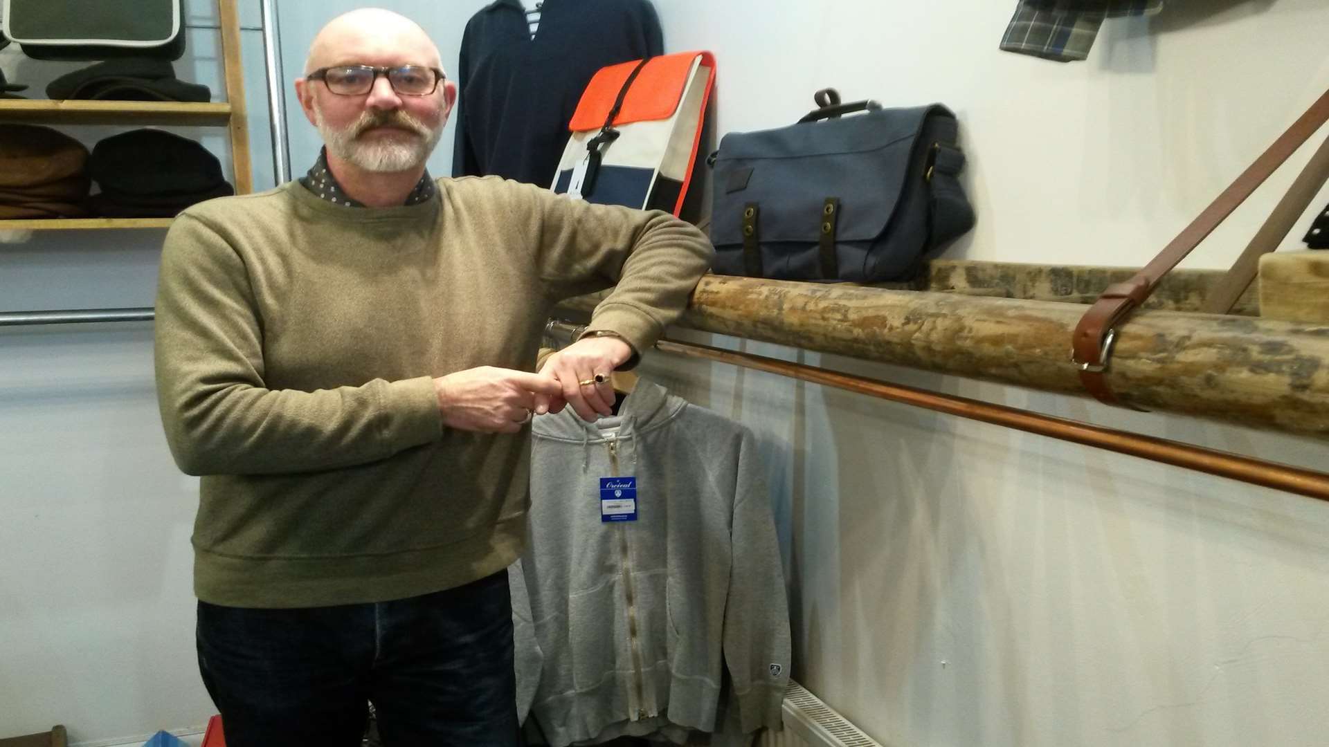 Owner Garrie Keeys with a half empty clothes rack at Ruskin