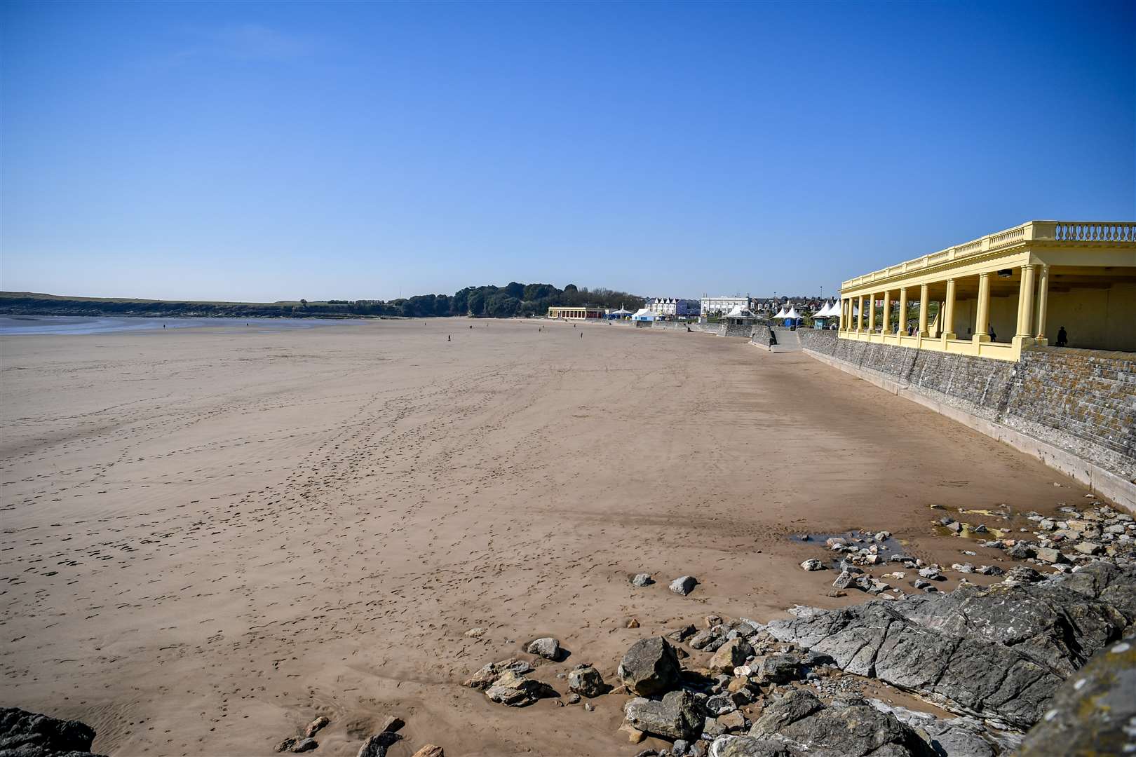 An empty beach in Barry Island, Wales, after social distancing measures were introduced (Ben Birchall/PA)