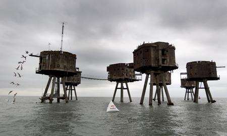 British divers Gary Hunt and Blake Aldridge dive from the Maunsell Forts in the Thames Estuary.