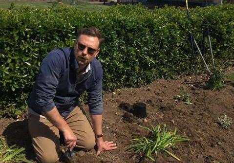 Ben Wykes from Friends of Cliftonville Coastline (FOCC) helps plant new flower beds. Picture: FOCC