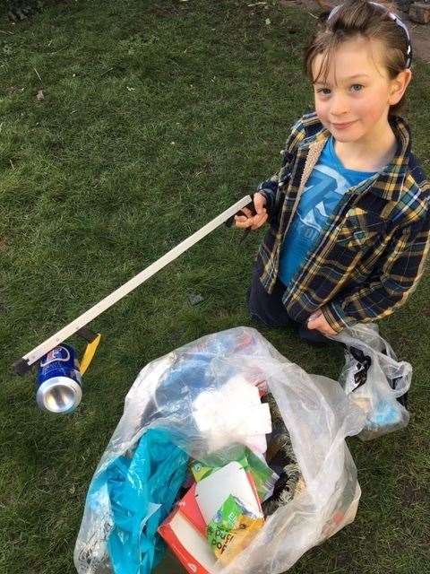 Ruben Houghton-Robert, nine, clearing rubbish in Whitstable. Picture: Fiona Houghton