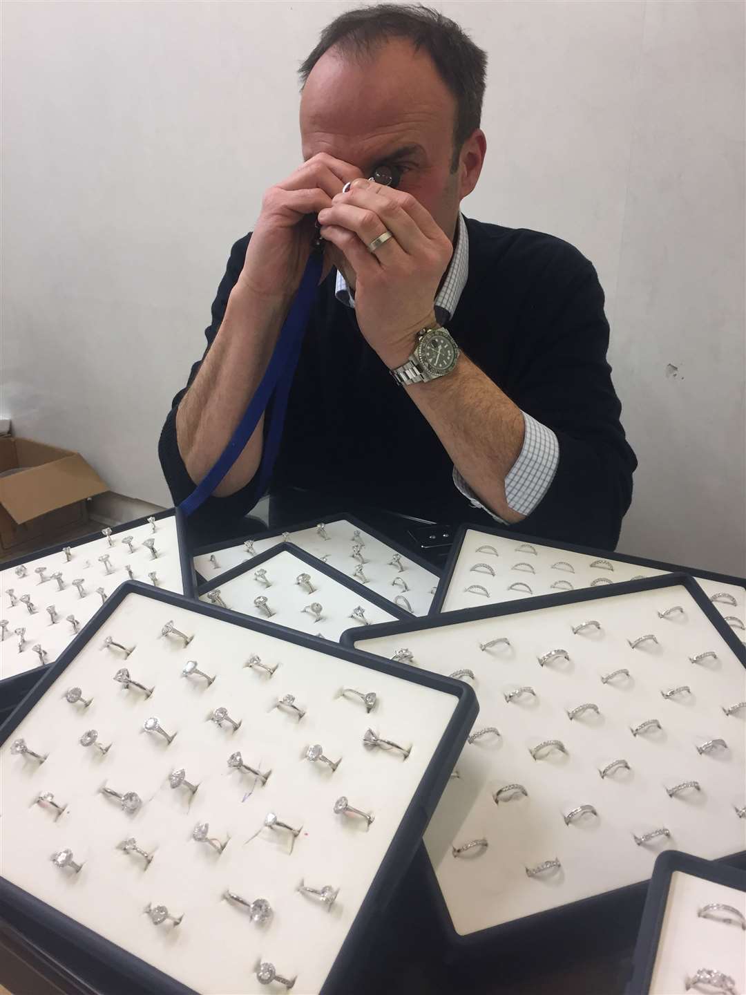 Neil Duttson examining a diamond