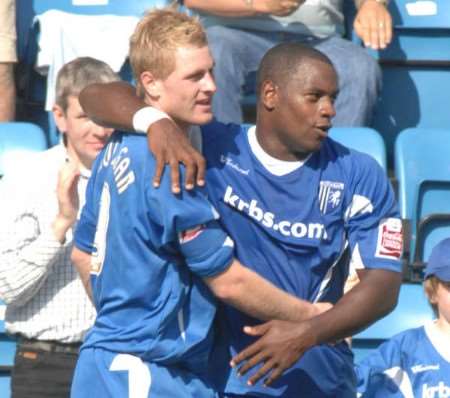 Gary Mulligan celebrates his second goal against Walsall with strike partner Delroy Facey