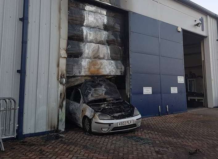 The car was set alight after being reversed into the gym's doors