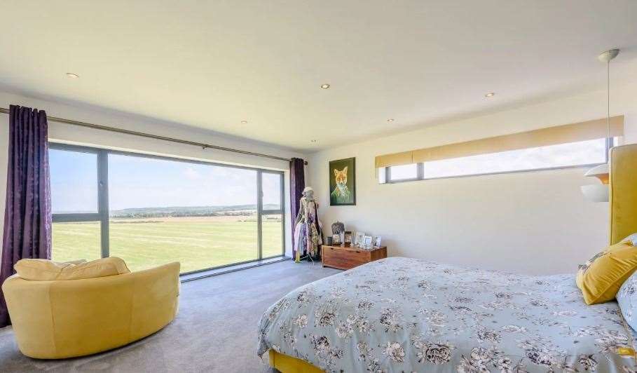 There are five bedrooms, some of which look out onto the terrace and surrounding countryside. Picture: Strutt and Parker