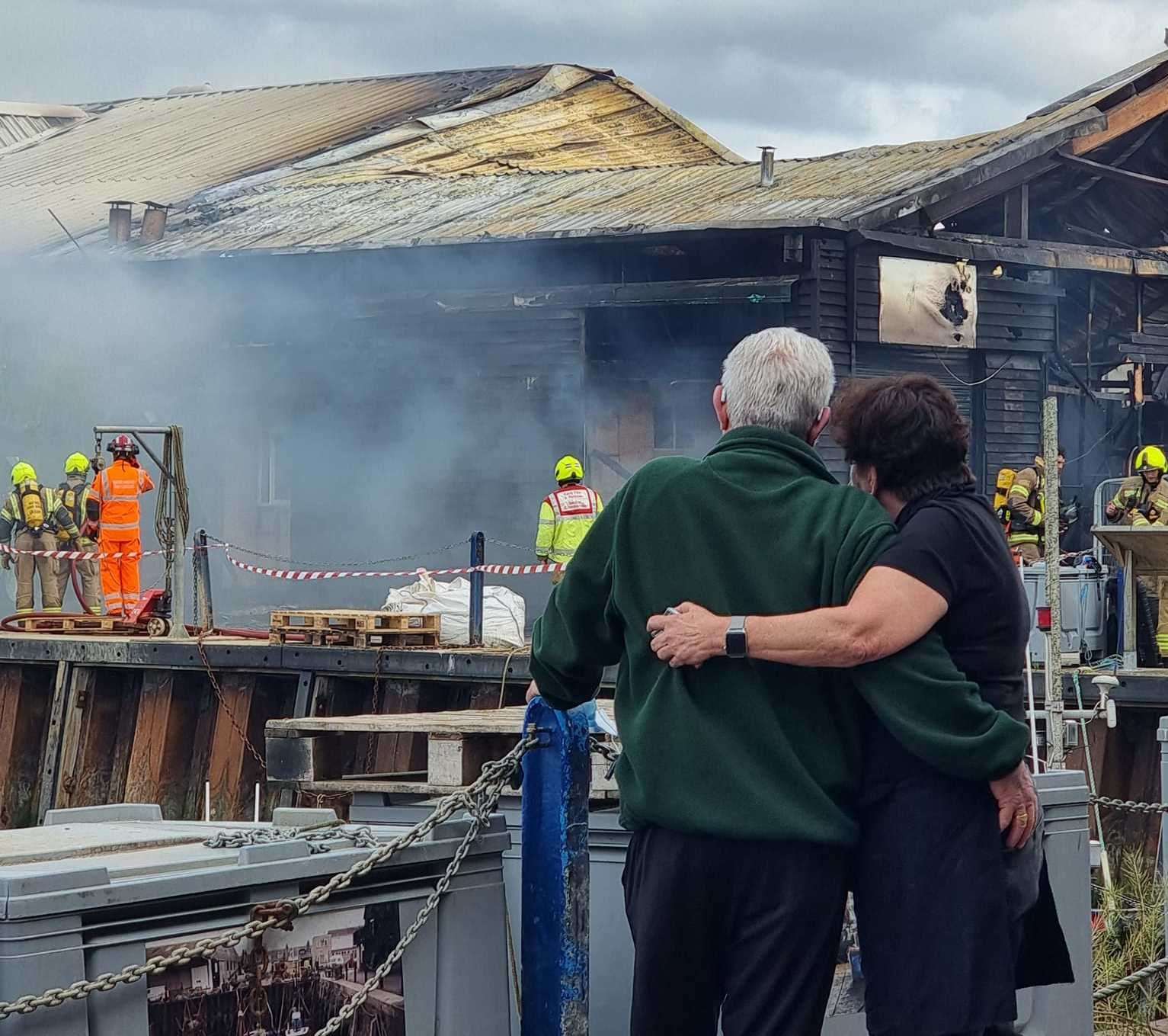 Crab and Winkle Restaurant owners Peter and Elizabeth Bennett watched as the fire engulfed their business. Picture: Charlotte Rose Nash