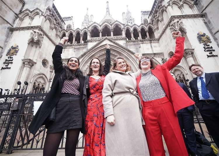 Reclaim These Streets founders Henna Shah, Jamie Klingler, Anna Birley and Jessica Leigh celebrate after judges ruled that Met Police beached the rights of the organisers of a planned vigil for Sarah Everard. Picture: Yui Mok/PA