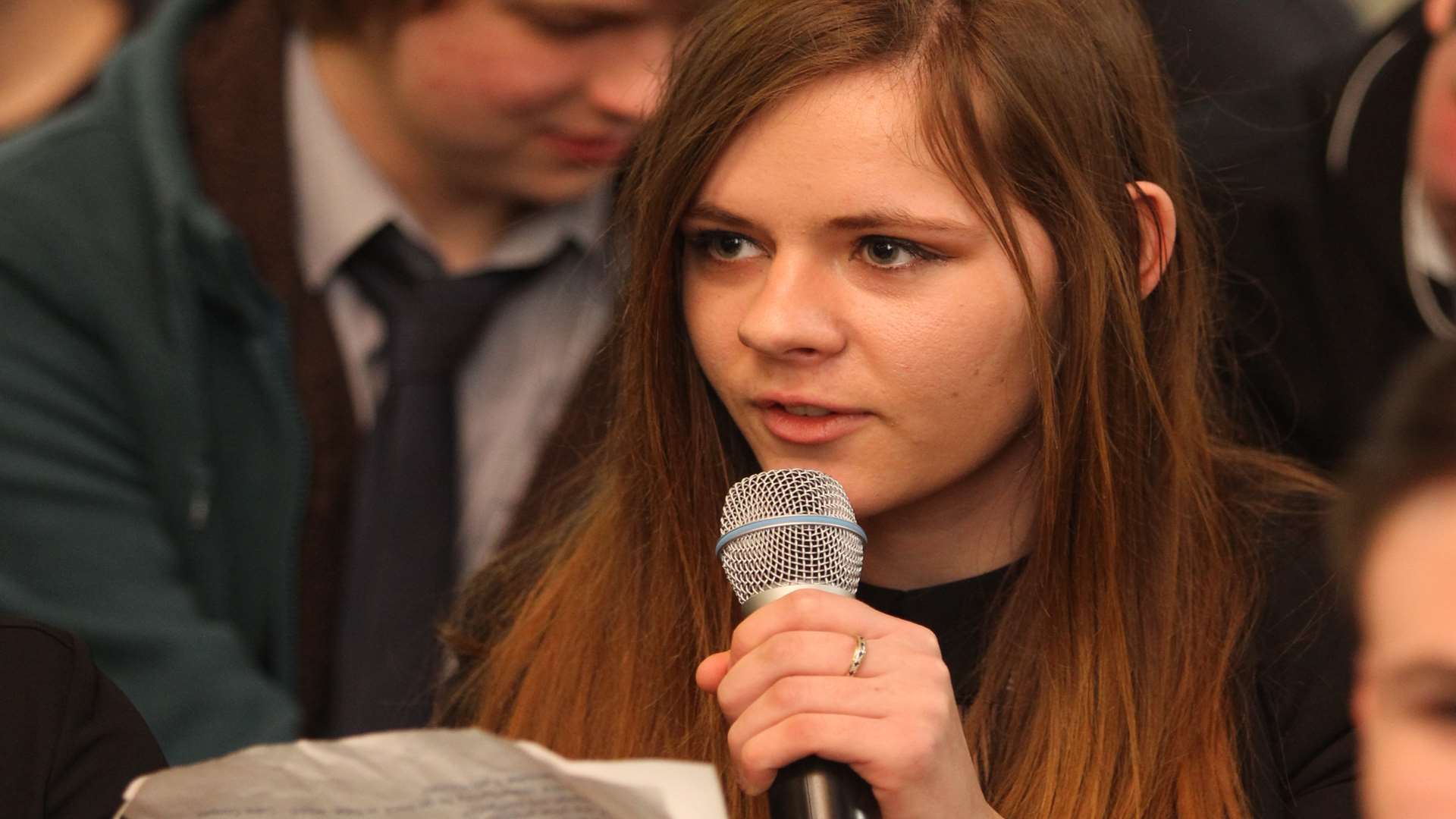 Charlotte Buck, 16 asks a question of a political made up panel at a Question Time styled forum held at Walderslade Girls's School