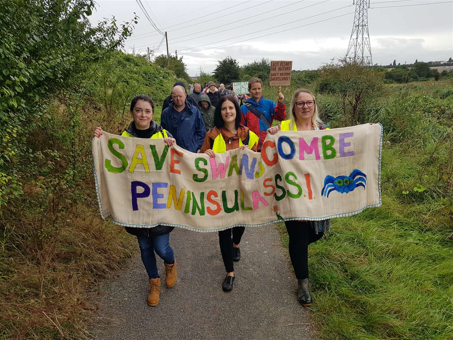 Cllr Laura Edie, pictured centre, was among those campaigners who attended a protest against plans to build a theme park on the Swanscombe Marshes. Photo: Save Swanscombe Peninsula