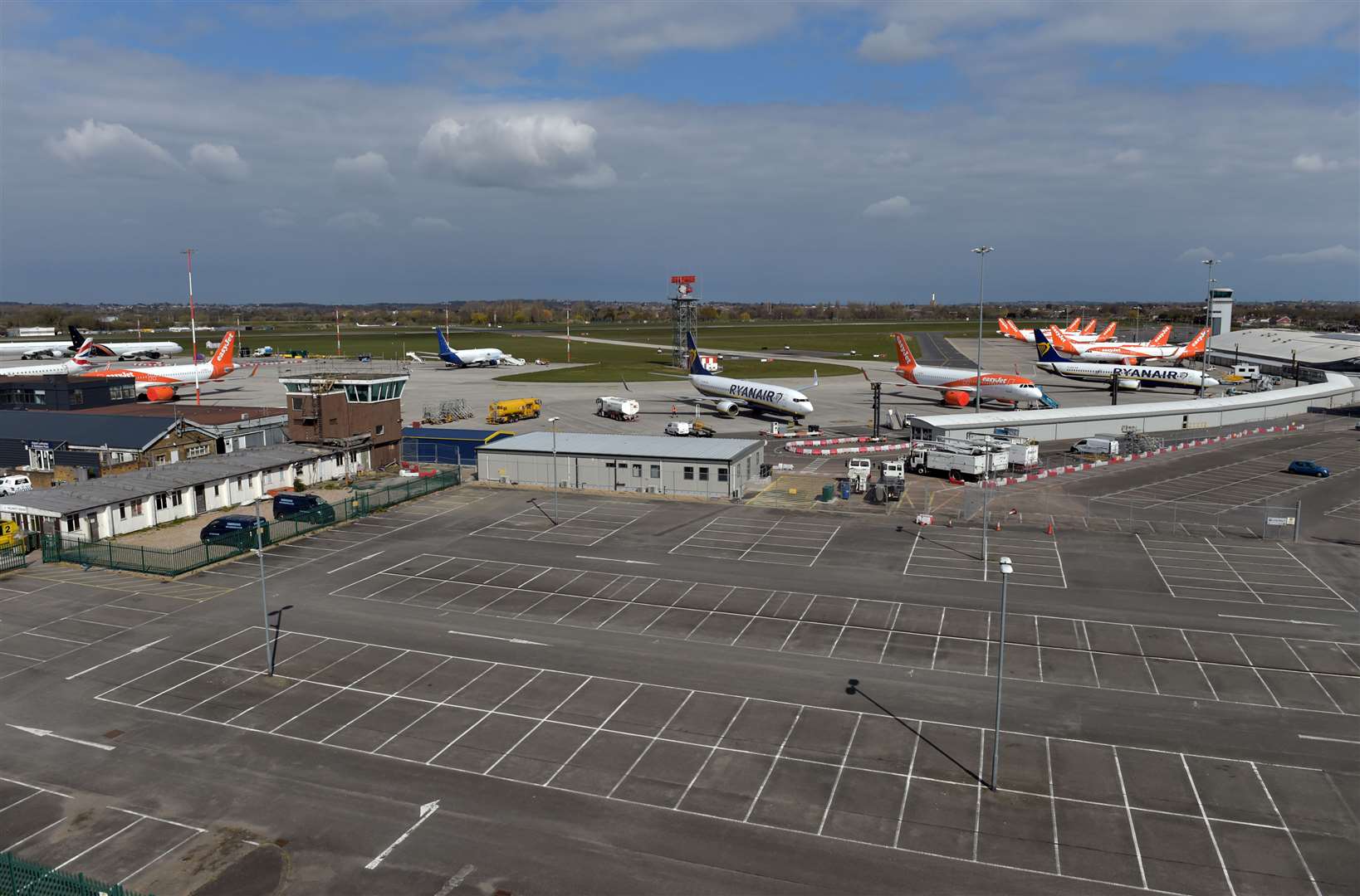 Ryanair and easyJet aircraft parked near to an empty long stay car park at Southend airport after airlines reduced flights amid travel restrictions (Nick Ansell/PA)