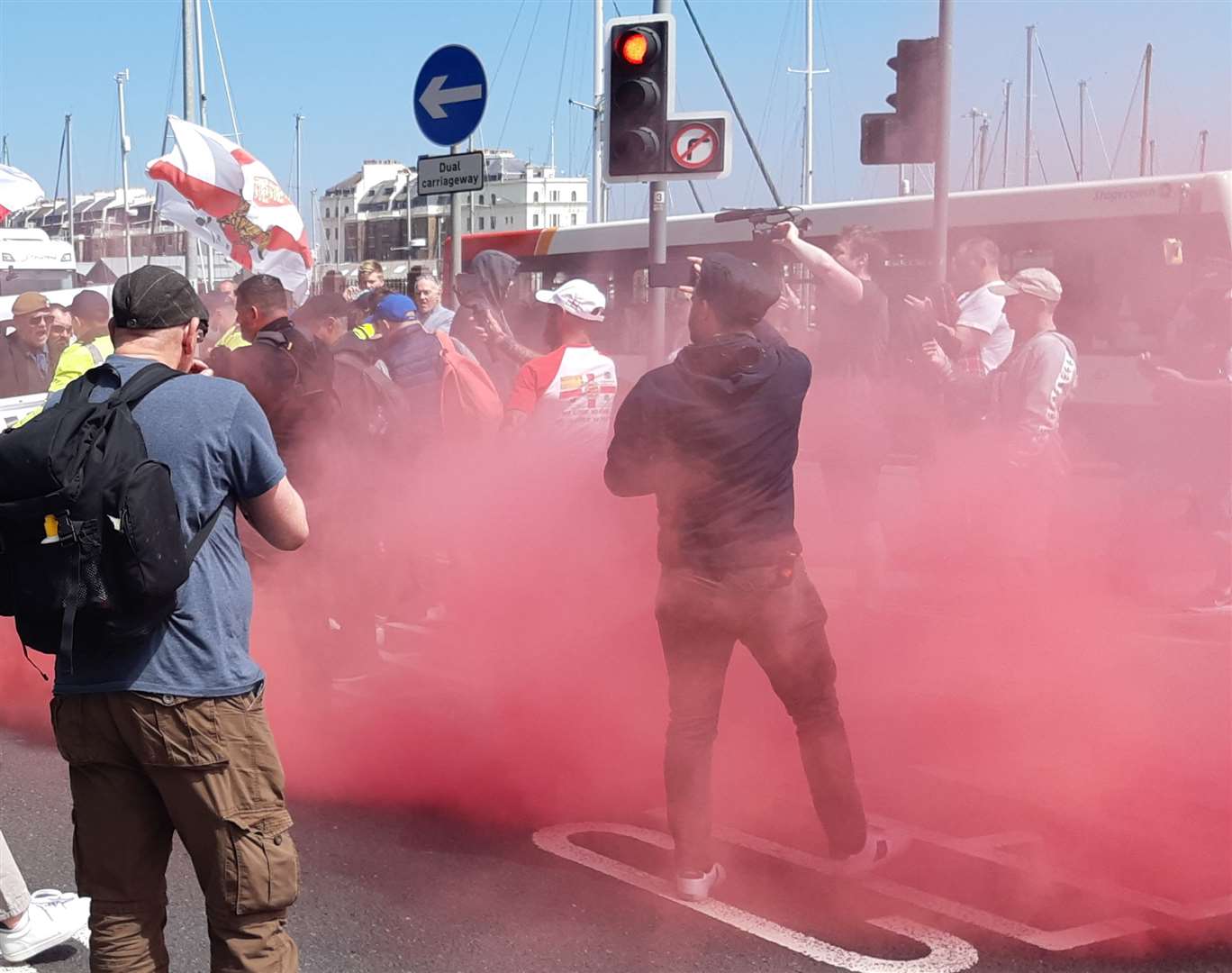 Somebody set off a harmless red smoke canister during the march at Snargate Street, Picture: Sam Lennon