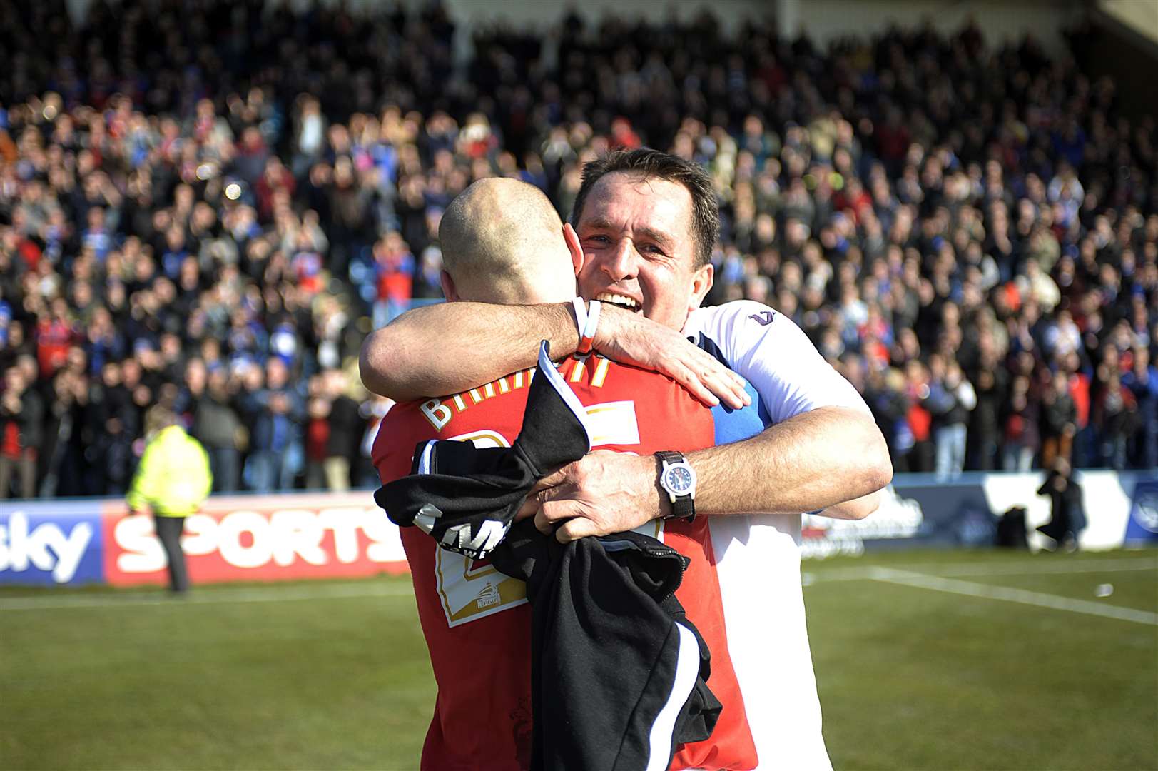 Gillingham manager Martin Allen celebrates promotion with captain Adam Barrett in 2013 Barry Goodwin