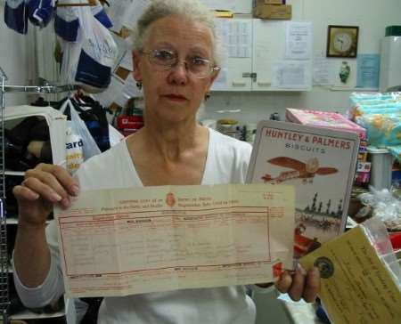 Sue Ryder shop manager Margaret Hanlon with the birth certificate and other items handed in by mistake