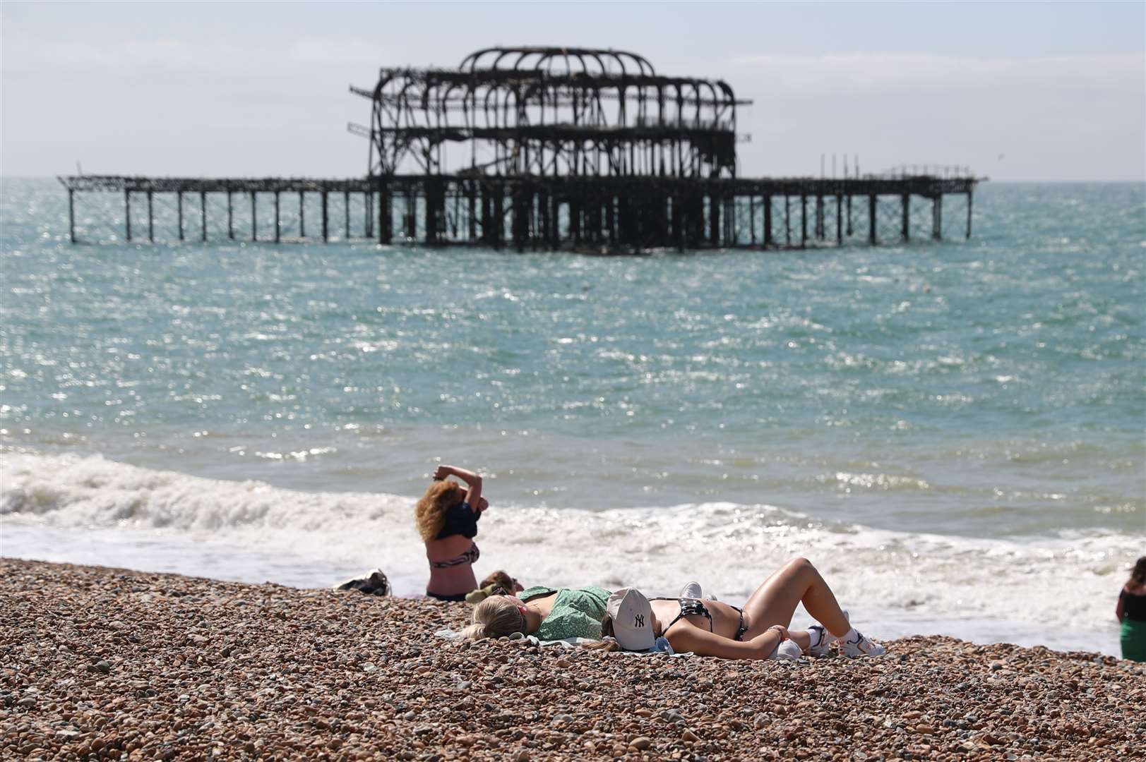 People enjoy the hot weather further along the south coast in Brighton (Steve Parsons/PA)