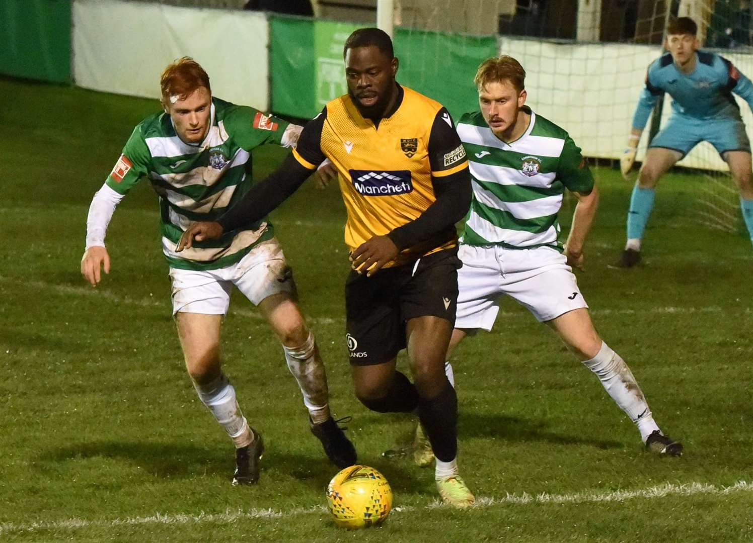 Maidstone striker James Alabi comes under pressure during Tuesday night's 2-1 Kent Senior Cup defeat at Corinthian. Picture: Steve Terrell