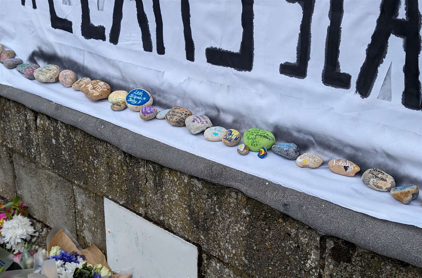 Tributes to Leah Daley left at the bandstand on The Leas in Folkestone following the discovery of a body in the search for the missing 24-year-old