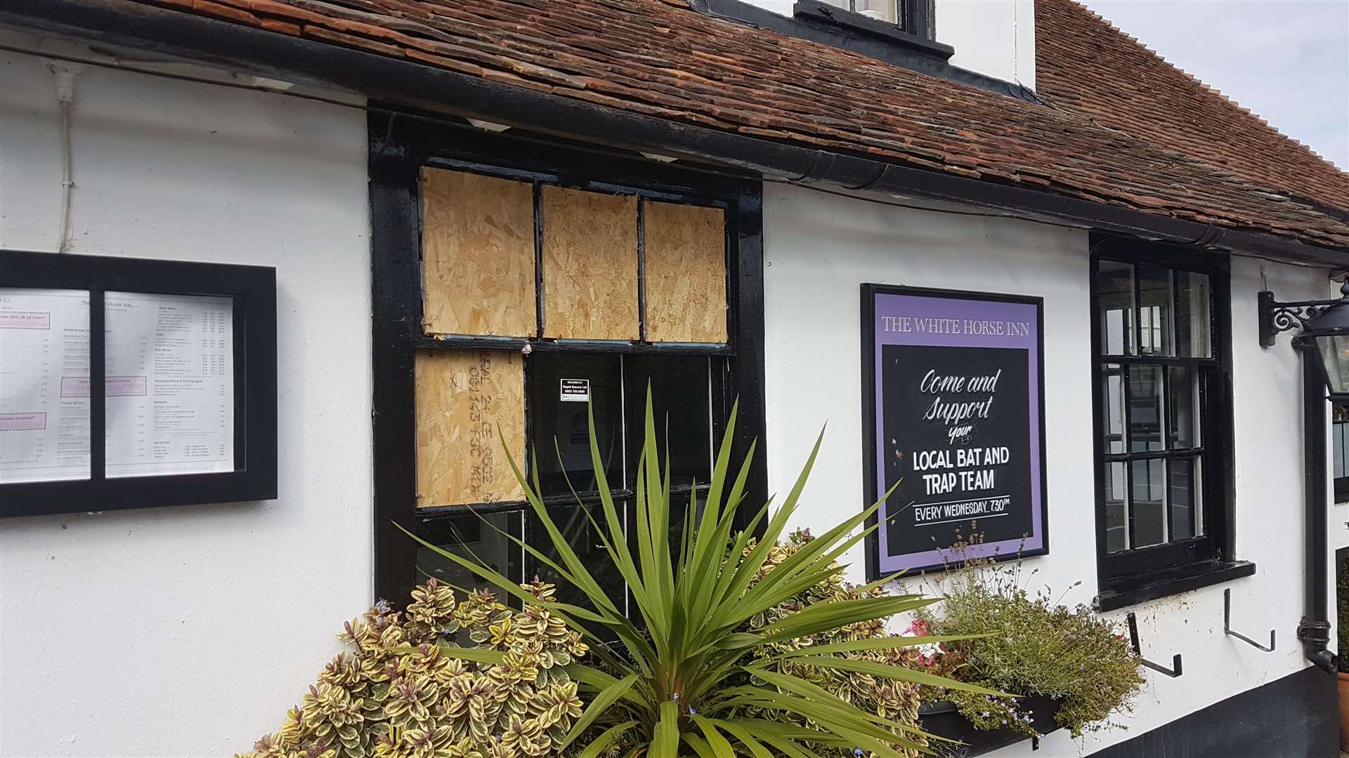 Windows have been boarded up following damage