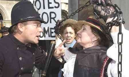 CONFRONTATION: 'Policeman' Craig Mackinlay and 'suffragette' Carol Scott. Picture: GRANT FALVEY