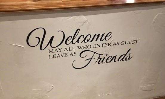 Walking through the side door into an open reception area you are greeted by this sign.
