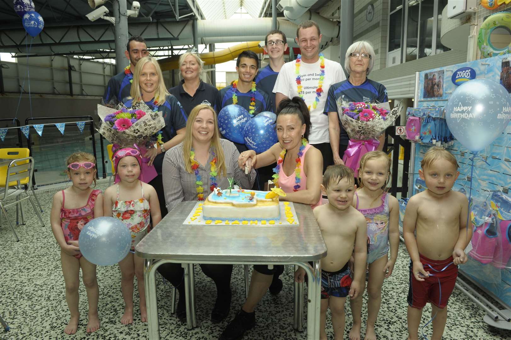 Jenny Dearlove and Tara Guile with staff and children on Splashes' 25th birthday