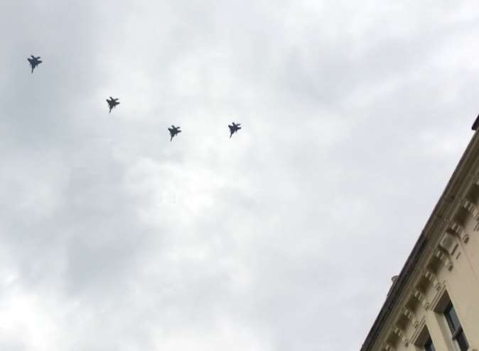 Four fighter planes in formation over Canterbury High Street