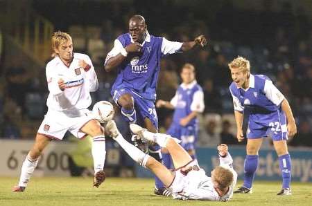 GRIM PROSPECT: Action from the Carling Cup clash against Northampton Town, who Gillingham could possibly be playing in League One next season. Picture: GRANT FALVEY