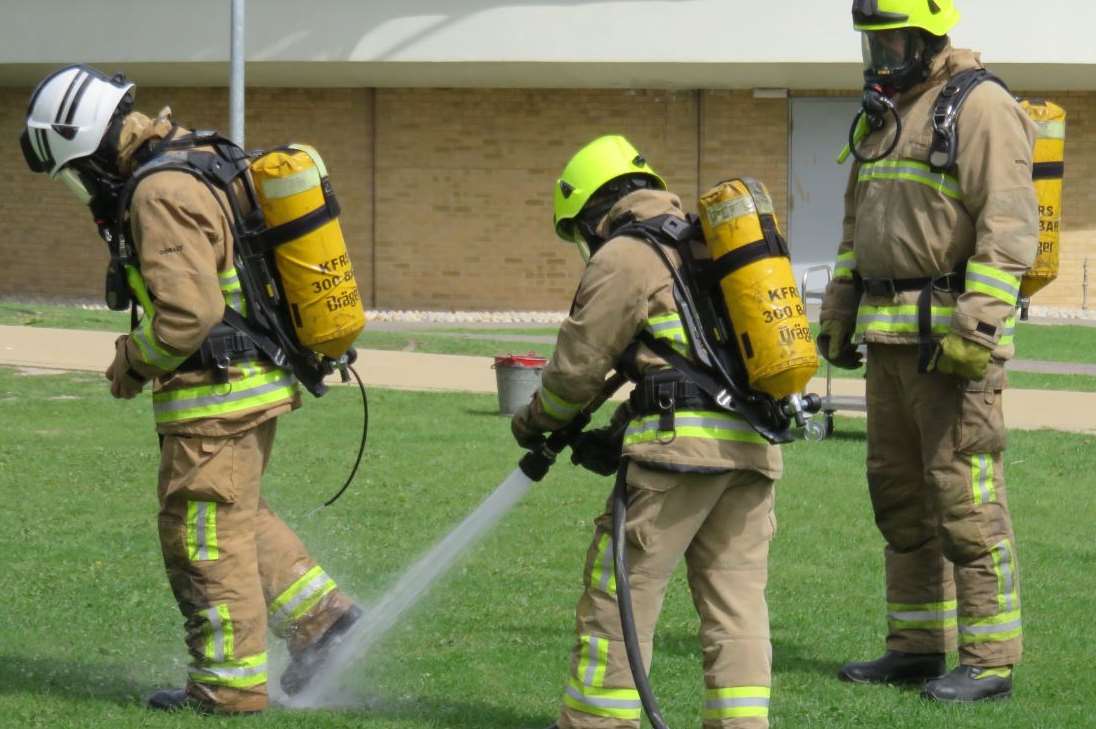 Firefighters hosed each other down to clean off any chemicals