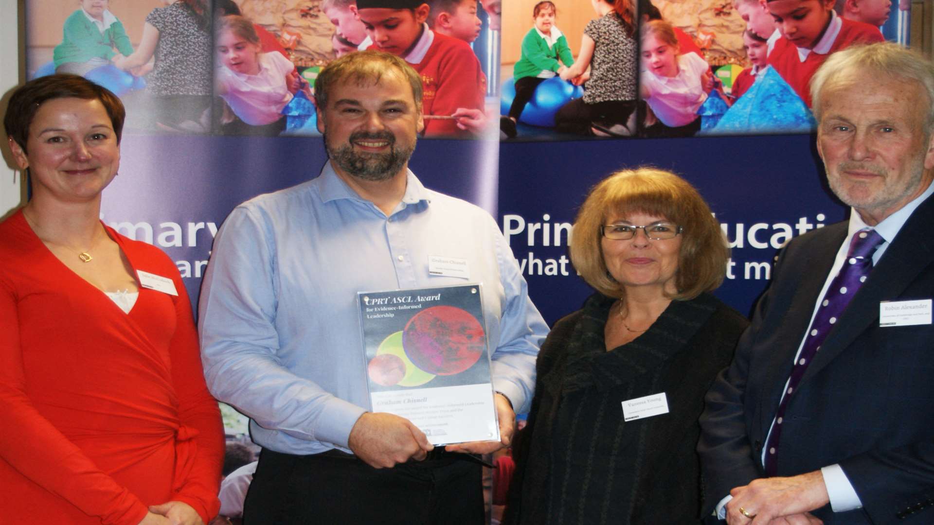 Graham Chisnell (centre left) receives his award from Julie McCullock from the Association of School and College Lecturers, Vanessa Young and Dr Robin Alexander