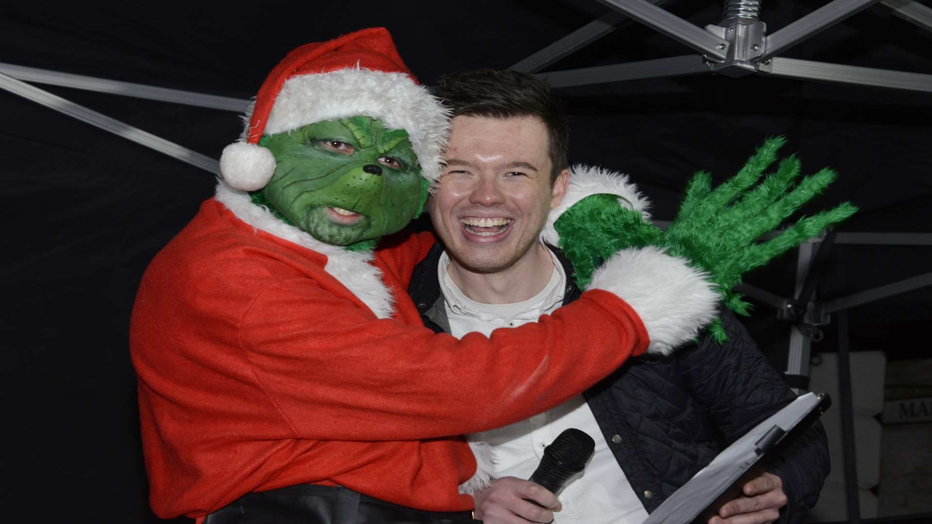 kmfm's Glen Scott in a clinch with the Grinch Picture: Paul Amos