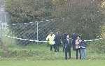 Police near the scene of the rape of a 10-year-old Ashford schoolgirl in November 2001