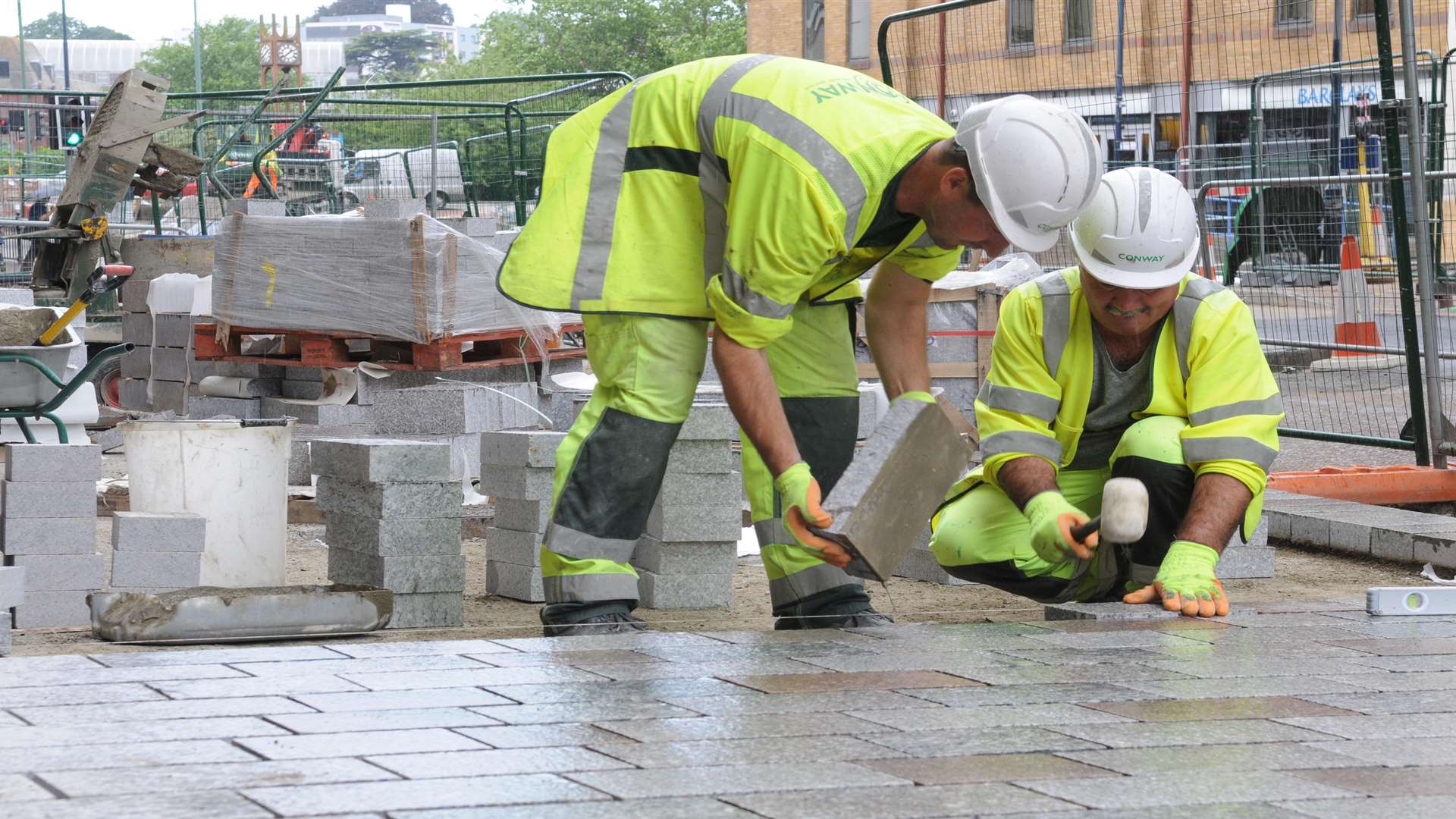 The first granite slabs being laid by contractors in Maidstone High Street in 2013. Picture: Wayne McCabe