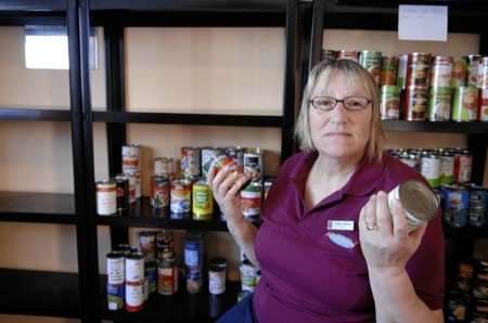 Valerie Barkley with the near-empty food shelves in her storeroom