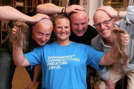 Head shave for charity. Philip Gibson, Yvonne Gibson, Alan Brown and Peter Gibson with their heads shaved.