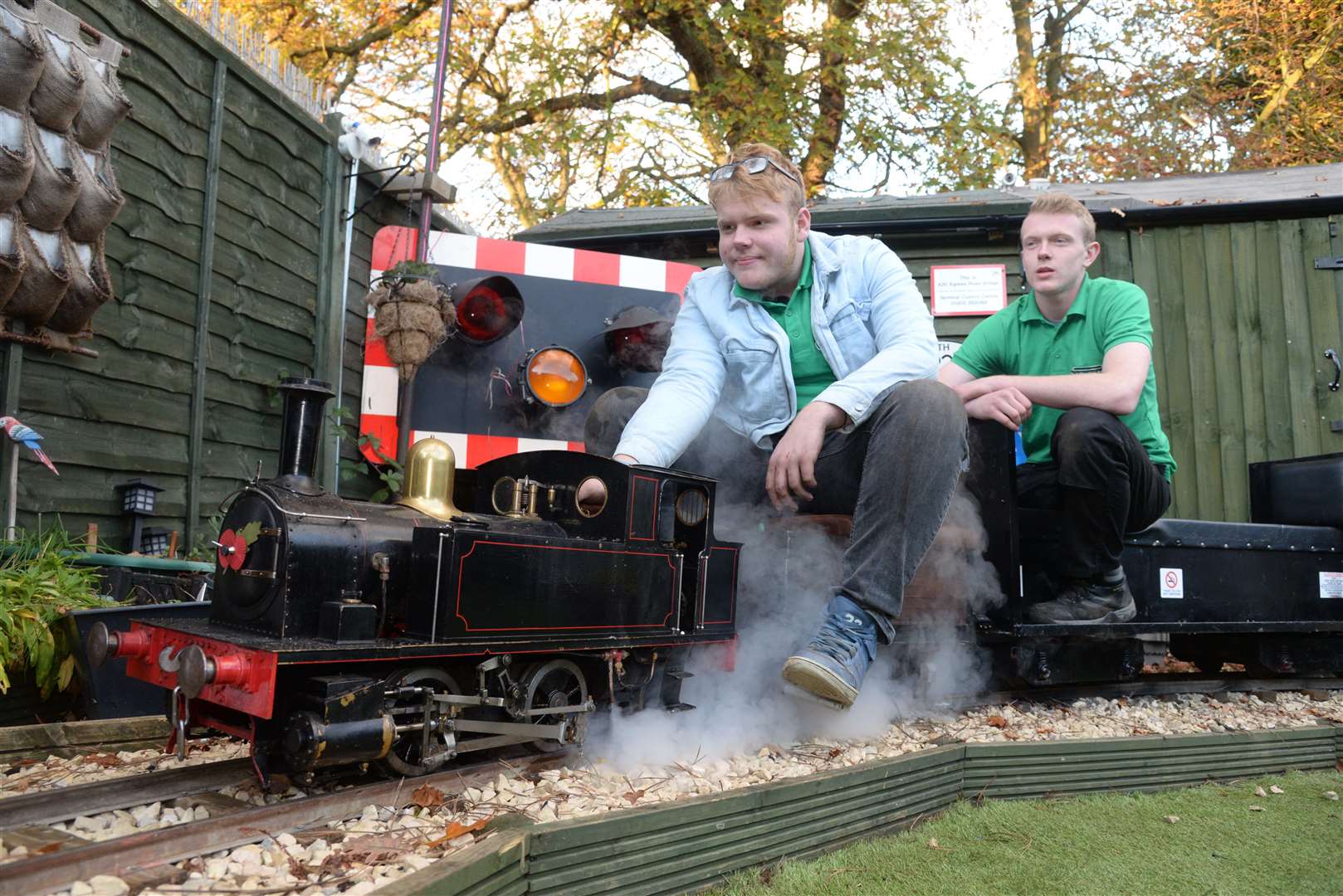 Oliver and George Stevens with their miniature railway in the garden of their home in Ashford. Picture: Chris Davey