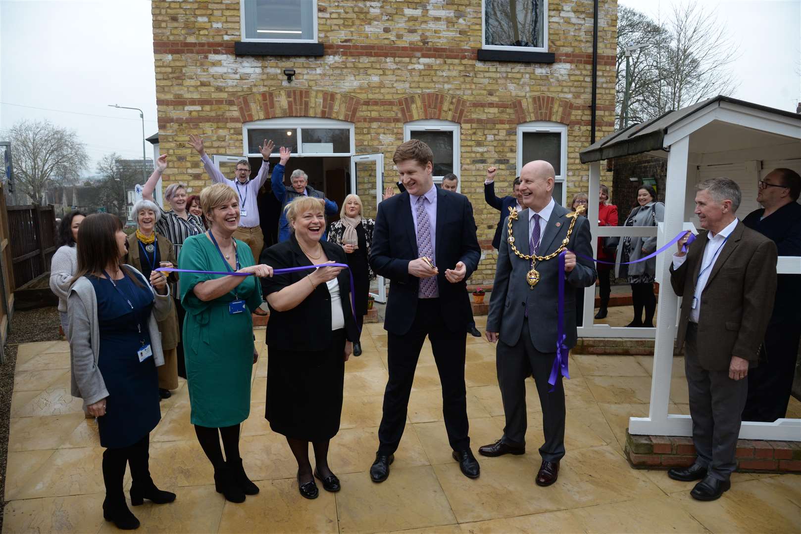 Police and crime commissioner Matthew Scott opens the new building at Maidstone and Mid Kent Mind with CEO Julie Blackmore, Mayor Cllr David Naghi and staff and guests on Friday. Picture: Chris Davey