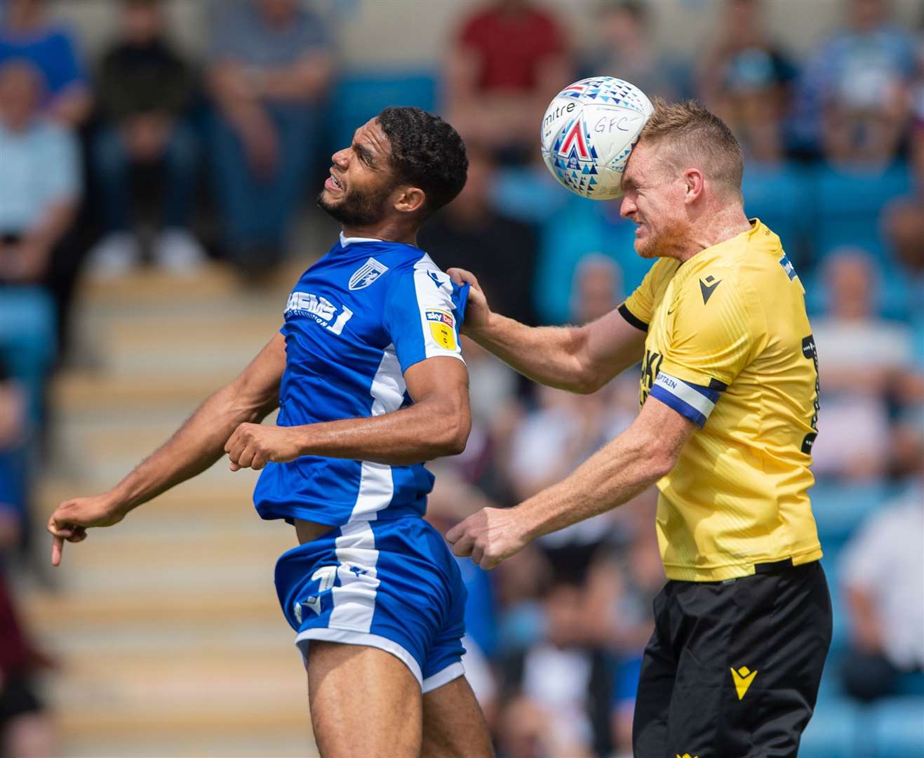 Gillingham trialist Mikael Mandron jumps with Millwall's Alex Pearce Picture: Ady Kerry