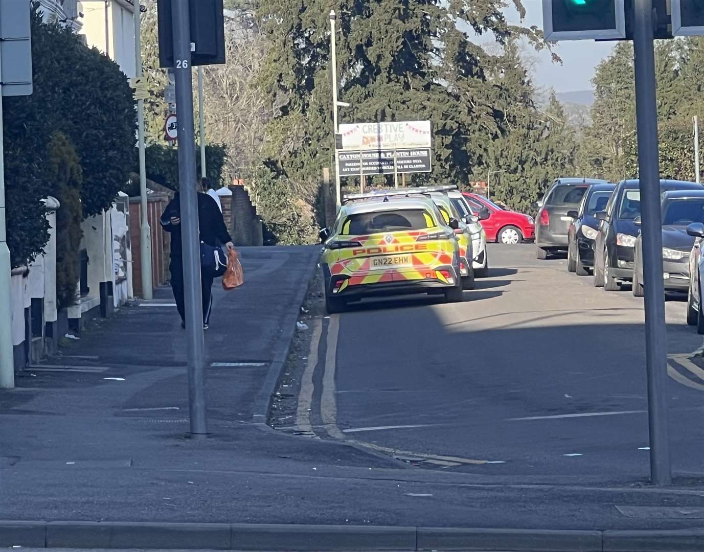 Three police cars were seen in Wellesley Road in Ashford