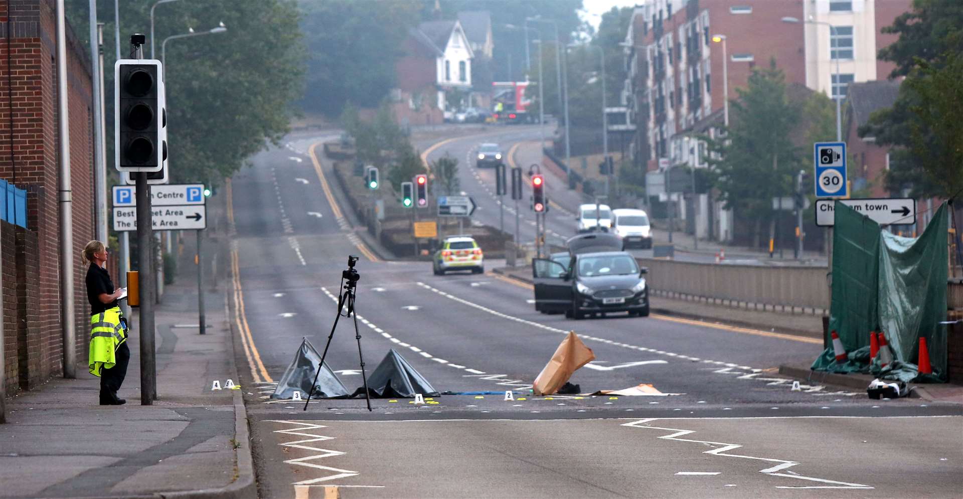 Police at the scene of a crash in New Road, Chatham. Images: UKNiP