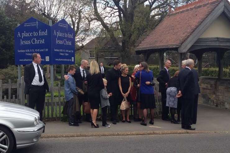Mourners gathered outside the church