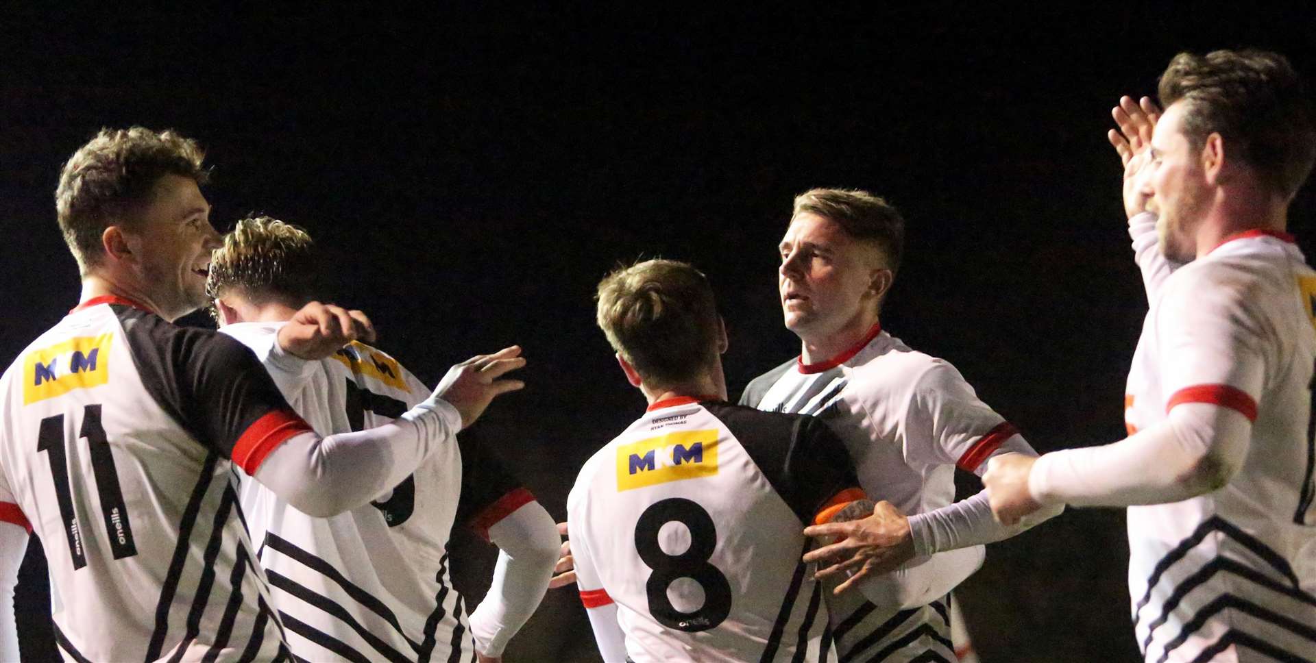Rory Smith celebrates his 74th-minute goal for Deal against Fisher with his team-mates. Picture: Paul Willmott