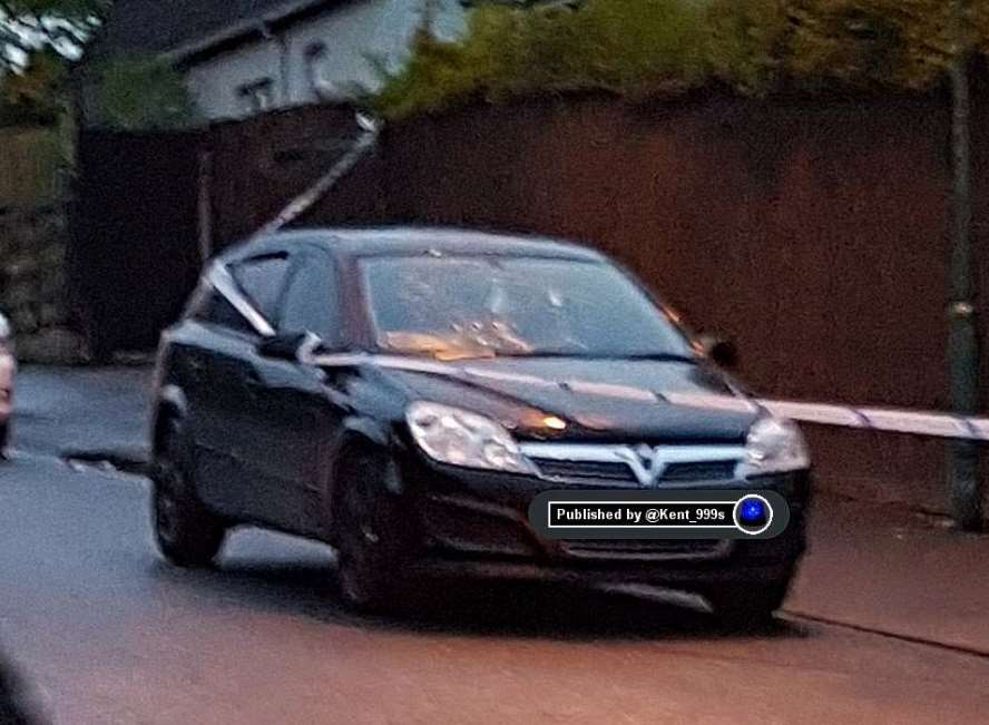 Police taped off this black Vauxhall Astra after Monday night's incident.