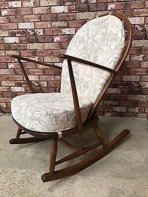The lost rocking chair is similar to this one, but with a deep pink seat cushion