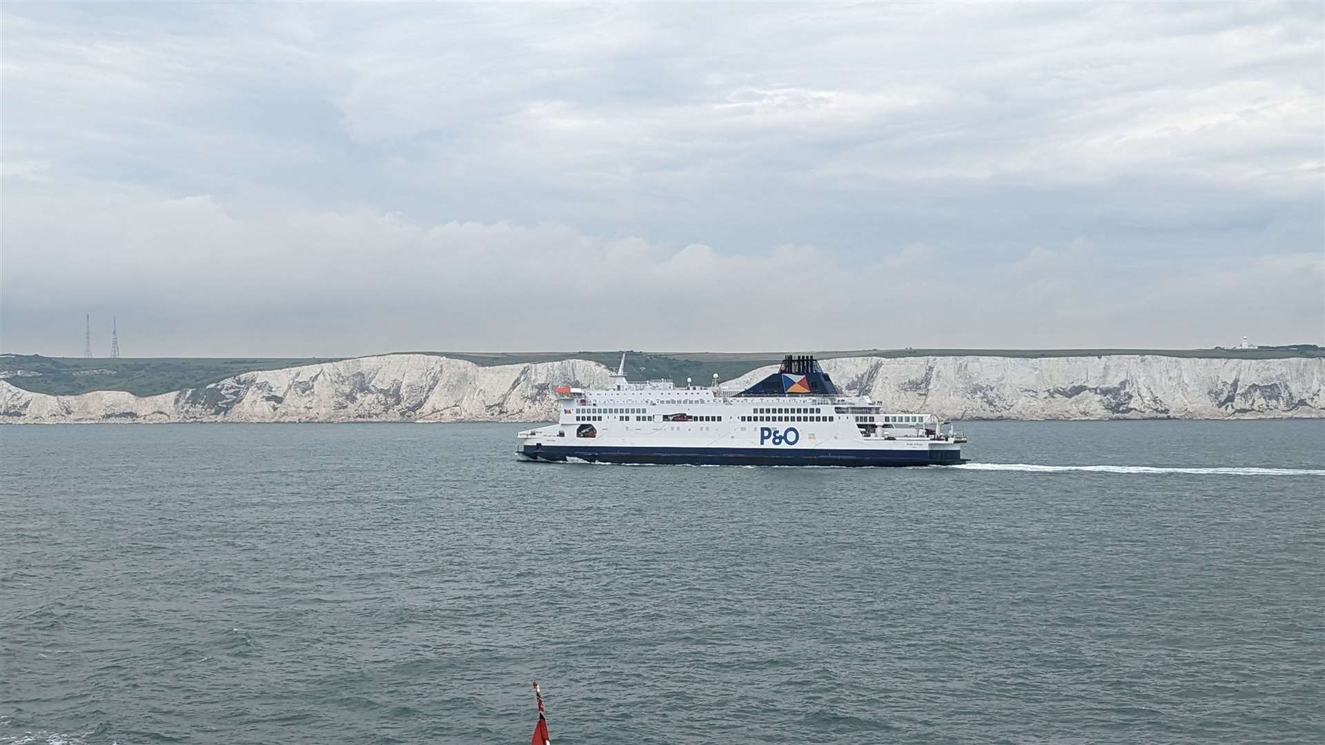 A P&O Ferries ship travelling from Calais to Dover passes in front of the White Cliffs of Dover