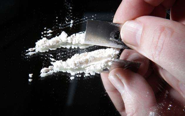 Stock image of cocaine being cut to go with story about Nicola Austen buying cocaine for her daughter's 18th birthday celebrations. (1028250)