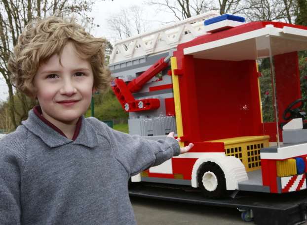 Luke Bray, six, with the fire engine. Picture: Martin Apps