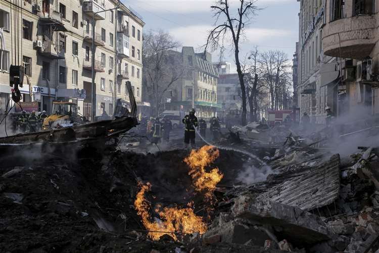 A crater left after a Russian rocket attack in Kharkiv, Ukraine’s second-largest city (Pavel Dorogoy/AP)