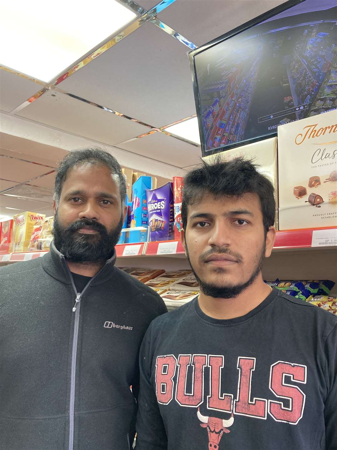 East Street News boss Nimal Ranachandran, left, and shop supervisor Sugash Selladurai, study CCTV footage after they say a boy threatened staff with a knife at the Sittingbourne shop. Picture: John Nurden (62242347)