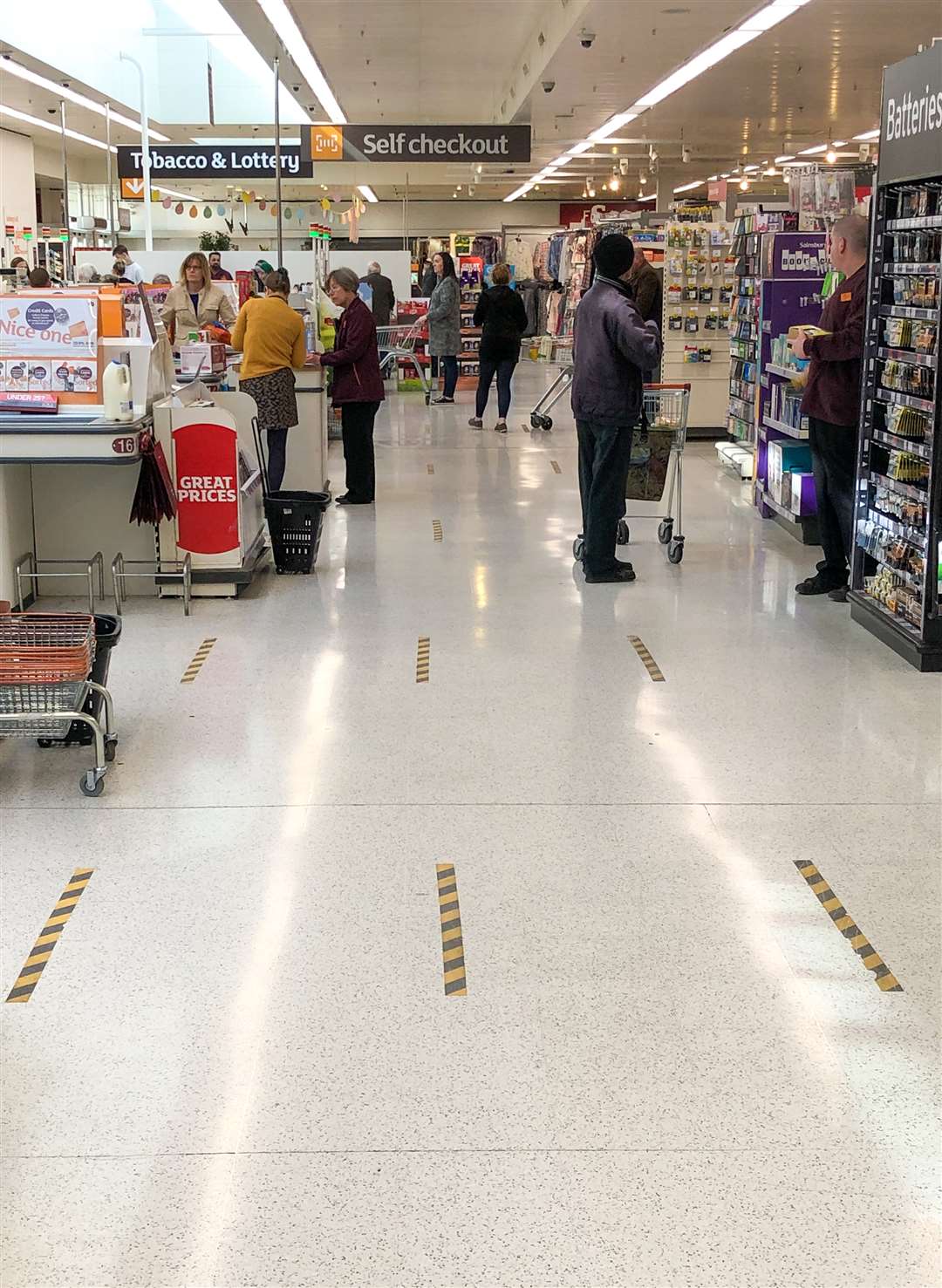 Markings on the floor at the checkout of a Sainsbury’s store in Peterborough, to implement social distancing measures and help curb the spread of the coronavirus (Joe Giddens/PA)